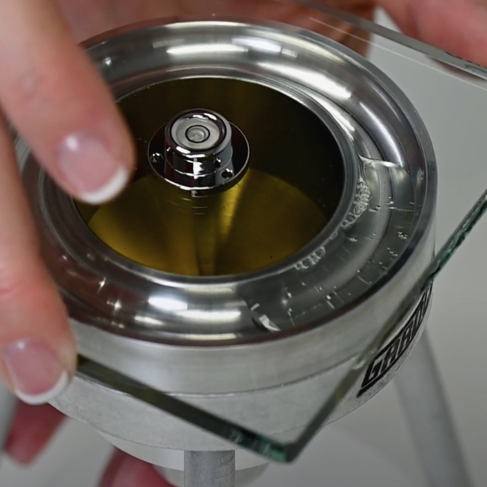 Glass Plate Level and Scraper in Use